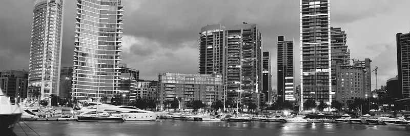 Beirut's Zaitunay Bay at dusk, with the marina and the waterfront towers lit up